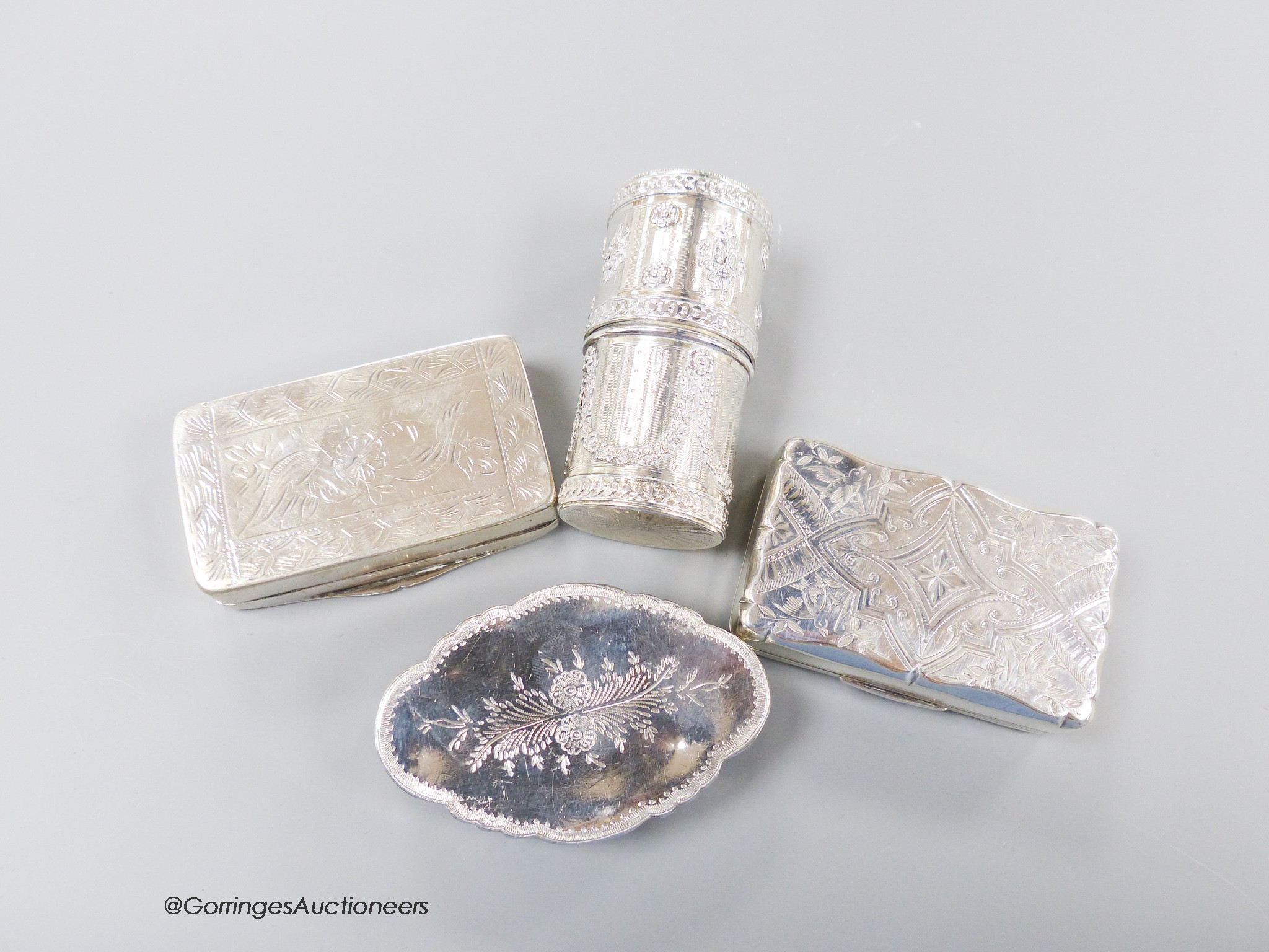 An early 20th century French white metal cylindrical box and cover, 72mm and three other continental white metal snuff boxes, including one embossed with an angel, 7.5oz.